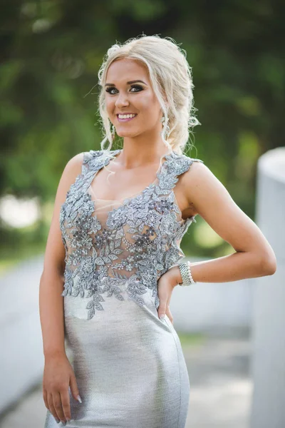 Blonde Lady Silver Evening Dress Posing — стоковое фото