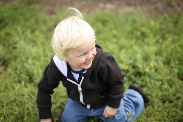 Happy Adorable Blonde Australian Kid Standing His Knees Grass — ストック写真