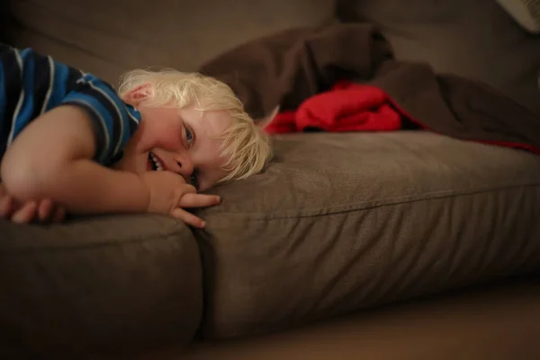 Happy Blonde Caucasian Kid Lying Sofa — Stock Photo, Image