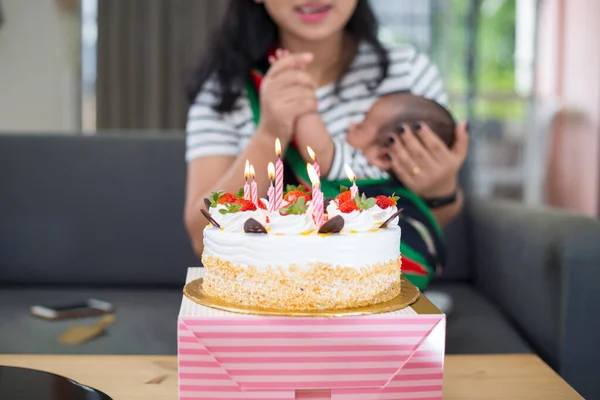 Strawberry Birthday Cake Lit Candles Caring Mother Holding Newborn Baby — 图库照片