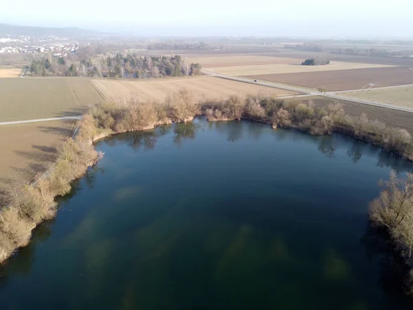 Aerial Shot Lake Agricultural Fields Little Town Distance — Φωτογραφία Αρχείου
