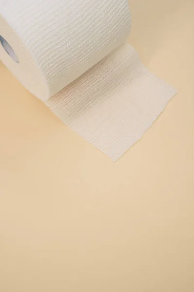 Vertical Shot Sterile Gauze Bandage Roll Isolated Light Beige Background — Stock Photo, Image