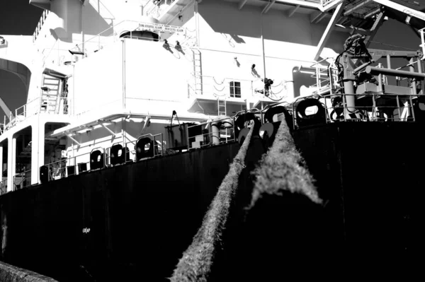 Grayscale Low Angle Shot Cargo Tanker Moored Pier — Stock Photo, Image