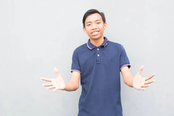 Indonesian Guy Blue Shirt Standing Outstretched Arms White Background — 스톡 사진