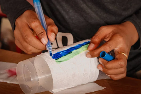 Selective Focus Shot Person Drawing Lines Blue Marker Plastic Cup — Stock Photo, Image