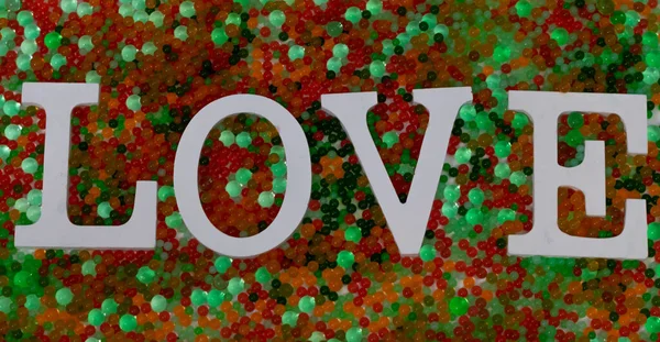 Närbild Ordet Kärlek Färgglada Pärlor Perfekt För Tapeter — Stockfoto