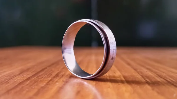 Closeup Shot Metal Ring Wooden Table — Φωτογραφία Αρχείου