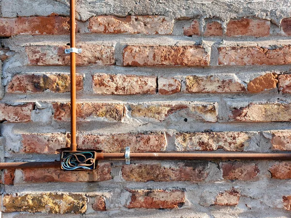 Brick Wall Orange Stones Rusted Rods — Stock Photo, Image