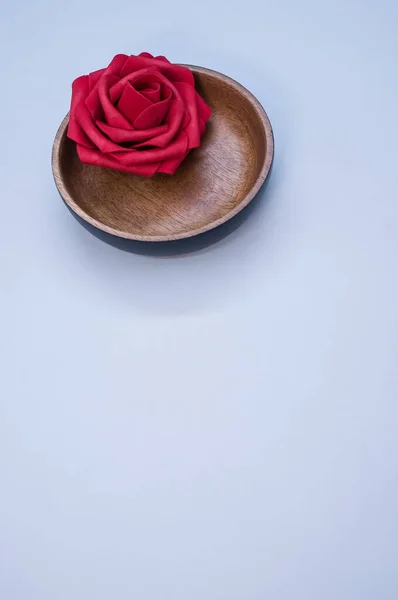 Vertical Shot Red Rose Wooden Bowl Blue Background — Stock Photo, Image