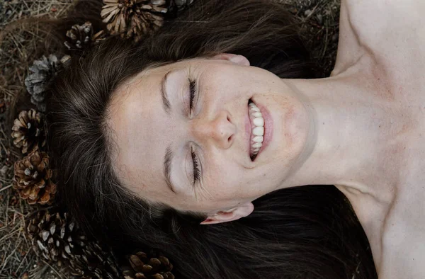 Happy Middle Aged Female Closed Eyes Lying Ground Pine Cones — Stock Photo, Image