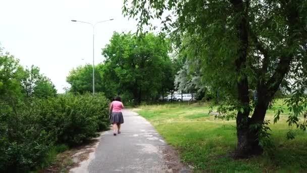 Woman Walking Footpath Green Grass Trees — Stock Video