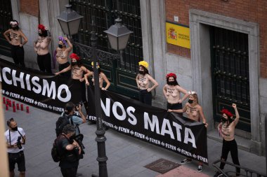MADRID, SPAIN - Jun 11, 2021: Feminist demostration in the Ministry of justuce in Madrid against gender violence clipart