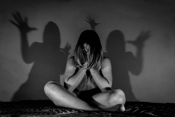 Girl Sitting Bed Covering Her Face Fear Her Disturbing Shadows — Stock Photo, Image