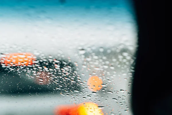 Closeup Window Raindrops Glass Orange Bokeh Lights Background — Stock Photo, Image