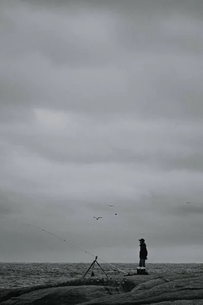 Grayscale Shot Fisherman Catching Fish Observing Beautiful View — Stock Photo, Image
