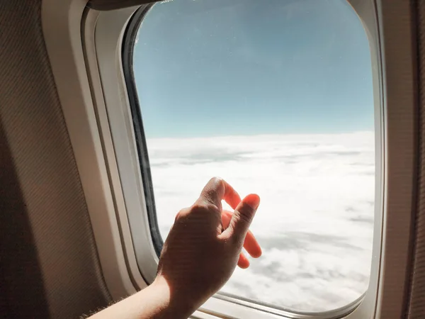 Closeup Shot Person Hand Airplane Window Looking Clouds — Stock Photo, Image