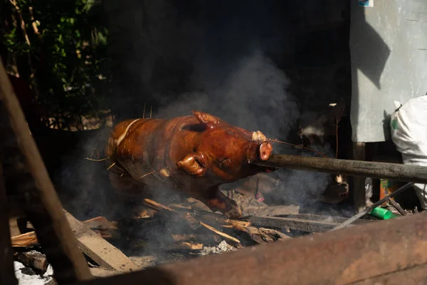 Grilled and Roasted Whole Pig Cooked on a Traditional Coal and Fire during a Festival and Birthday Celebration in the Philippines
