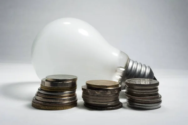 Old Lighting Bulb Home Group Coins Sign High Energy Consumption — Stock Photo, Image