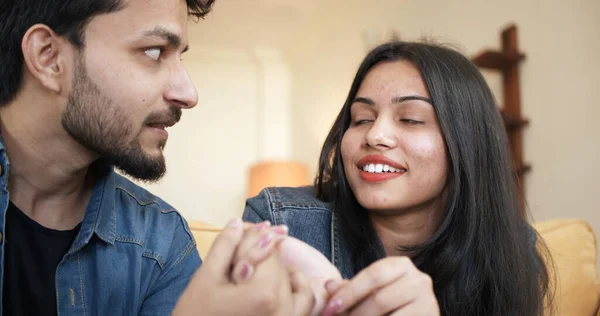 Young Indian Couple Touching Each Other While Happily Talking Spending — стоковое фото