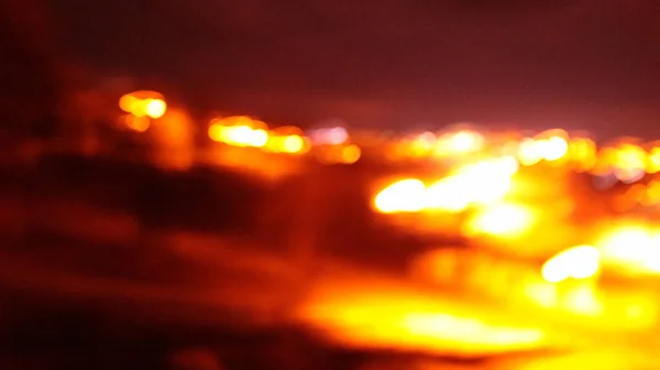 明るいオレンジ色の光の水平線の背景 — ストック写真