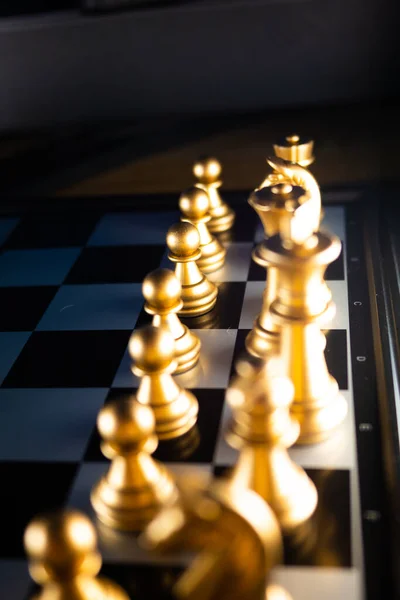 Horizontal shot of cool silver chess pieces in the starting position  reflected on the board Stock Photo by wirestock