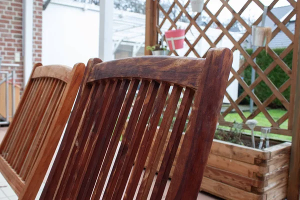 A closeup shot of wooden chair backs