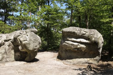 A Bizarre shape of Sandstone boulders, a famous area for bouldering, climbing, rock climbing, the circuit in Fontainebleau, France. clipart