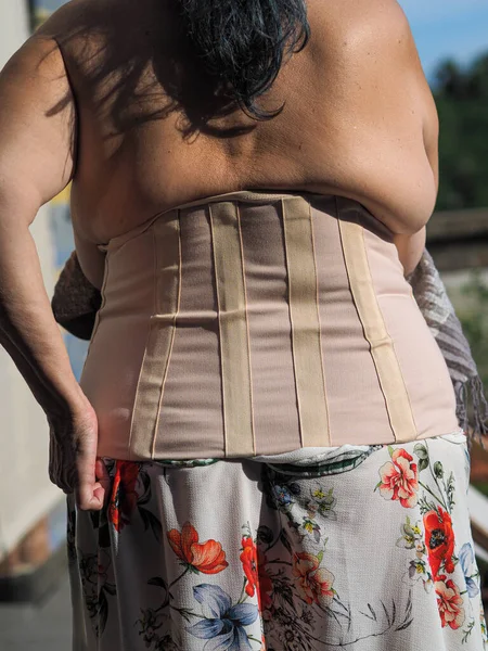 Shallow Focus Lady Wearing Semi Rigid Thoracic Lumbosacral Corset Curing  Stock Photo by ©Wirestock 489233352