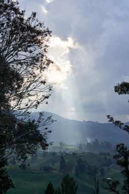 ENTRERRIOS, COLOMBIA - Jun 27, 2021: A mesmerizing view of a beautiful mountainous landscape in Antioquia Entrerrios Vereda Zancudo clipart