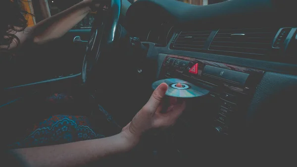 Caucasian Female Curly Hair Car Putting Optical Disc Player — Stockfoto