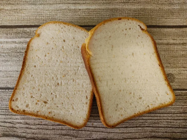 Twee Stukken Vers Wit Brood Houten Achtergrond — Stockfoto