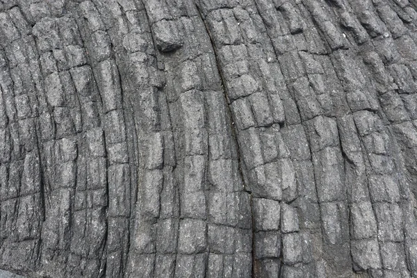 Κοντινό Πλάνο Της Υφής Των Μαύρων Ηφαιστειακών Πετρωμάτων Στην Παραλία — Φωτογραφία Αρχείου
