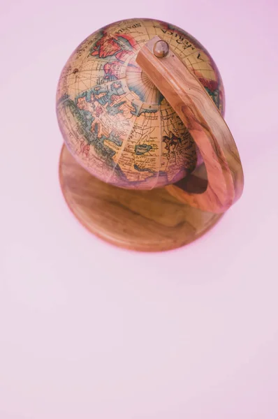 Vertical Shot Wooden Globe Isolated Pink Background Copy Space — Stock Photo, Image