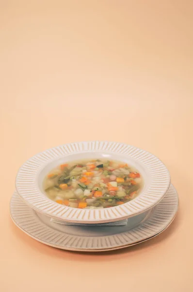 Vertical Shot Vegetable Soup Bowl Isolated Light Orange Background — Stockfoto