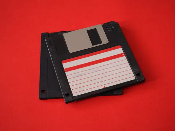 Two Vintage Storage Discs Red Background — Stock Photo, Image