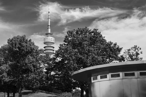 Grayscale Shot Big Tower Hidden Lush Trees Munich Germany — Stock Photo, Image