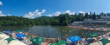 SOVATA, ROMANIA - Jul 25, 2021: It is a heliothermal lake with therapeutic properties clipart
