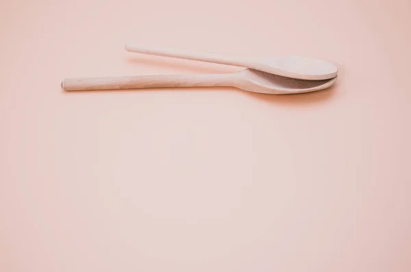 Closeup Shot Wooden Spoons Isolated Pink Background Copy Space — Stock Photo, Image