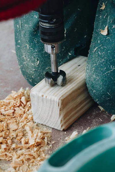 Vertical Shot Person Drilling Hole Small Wooden Cuboid Workshop — Stock Photo, Image
