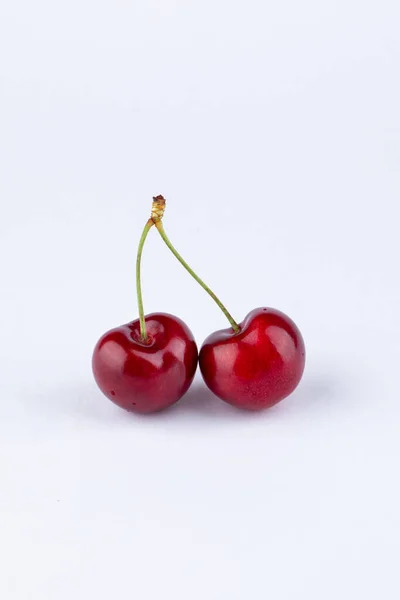 Vertical Closeup Two Cherries White Background — Stock Photo, Image