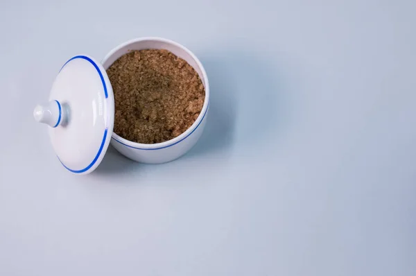 Closeup Brown Sugar Small Ceramic Jar Gray Tabl — Stock Photo, Image