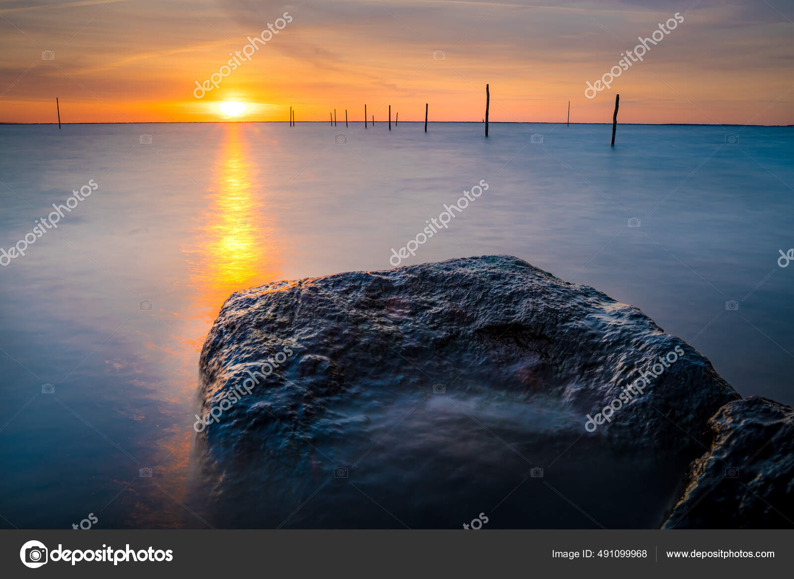 Beautiful Sunset View Lake Ijssel Fishing Net Poles Flevoland Netherlands  Stock Photo by ©Wirestock 491099968