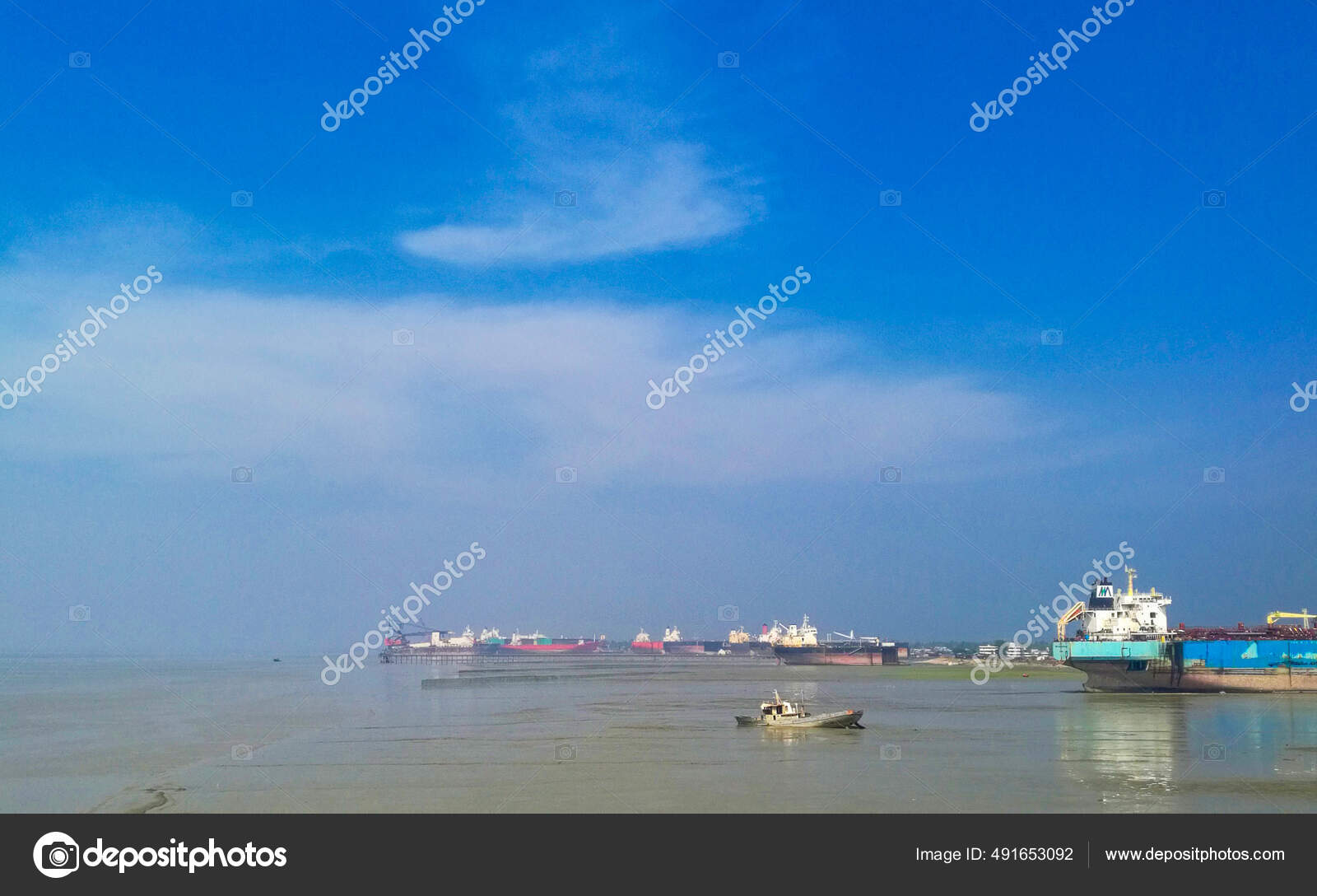 Cloudy Blue Sky Greenish Sea Full Big Small Boats Stock Photo by ©Wirestock  491653092