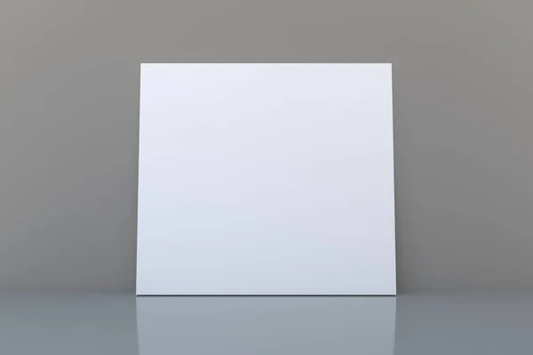 Uma Tela Branca Uma Superfície Cinza — Fotografia de Stock