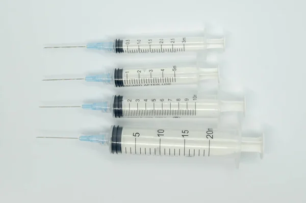 Top View Syringes White Table Going Big Small — Stock Photo, Image