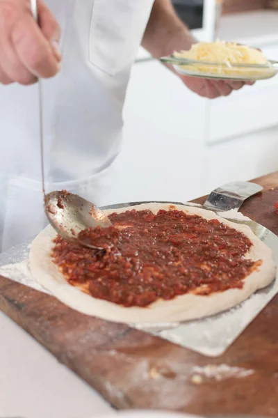 Closeup Shot Male Cook Hands Spreading Sauce Dough Pizza Making — Stockfoto