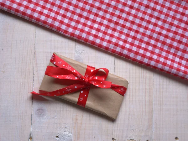Christmas Gift Wrapped Red Bow Ribbon Flat Lay Medium Shot Stock Picture