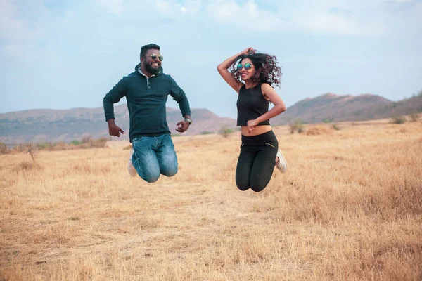 Happy Young Indian Couple Jumping Celebraiting Field Traveling Couple — Stock Photo, Image