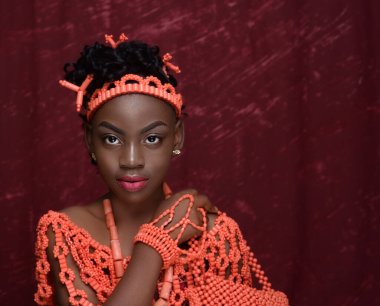 LAGOS, NIGERIA - Jul 24, 2021: A portrait of an African teenager in a traditional outfit of West Africa, Nigeria clipart