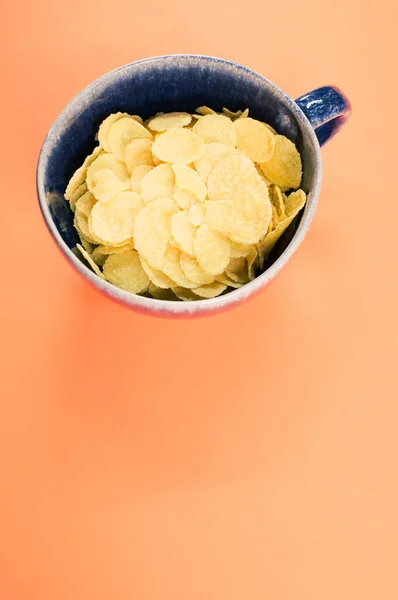 Vertical Shot Corn Flakes Cup Isolated Orange Background — Stock Photo, Image